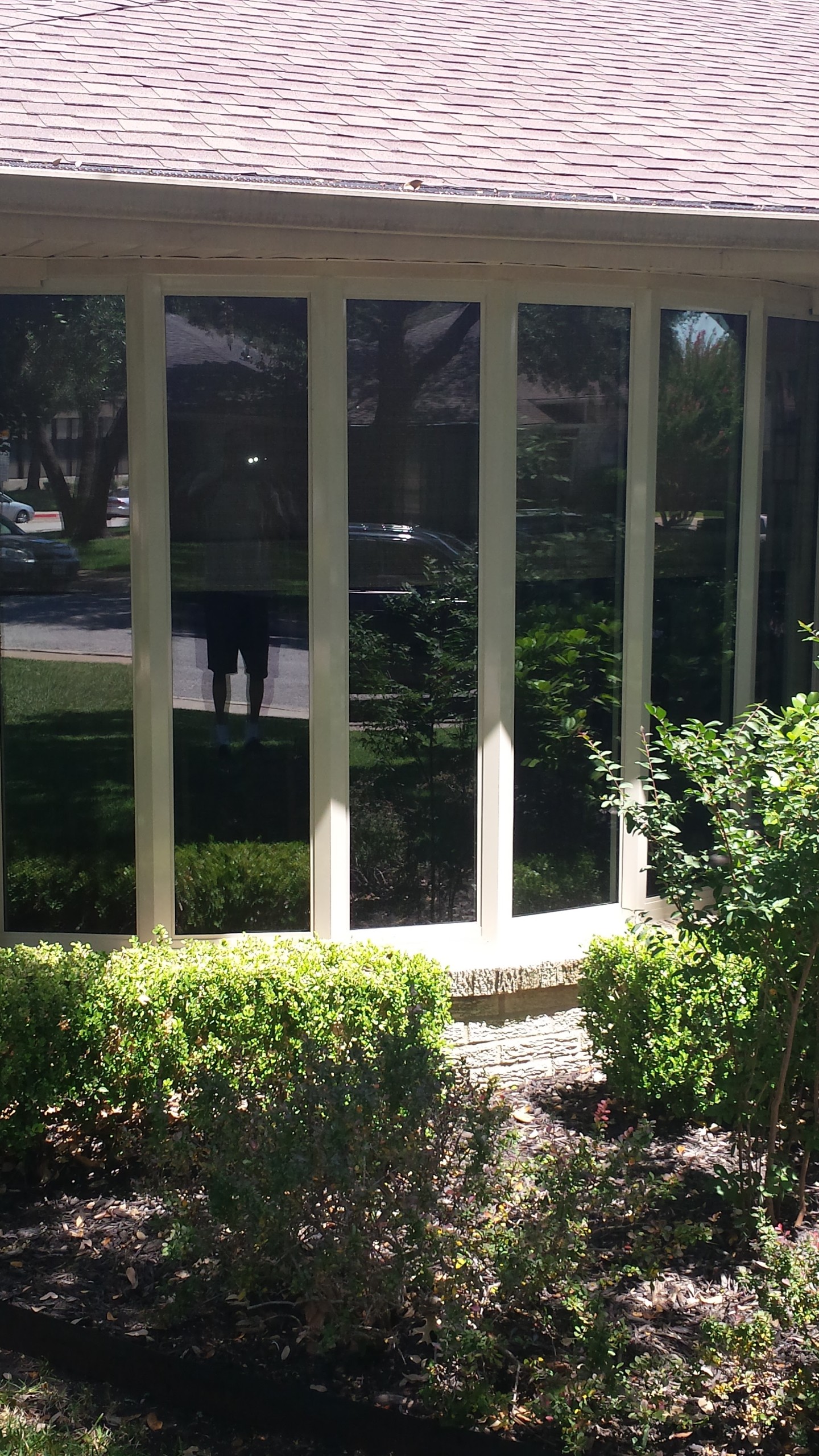 Multi-panel vinyl bay window with tall vertical panes